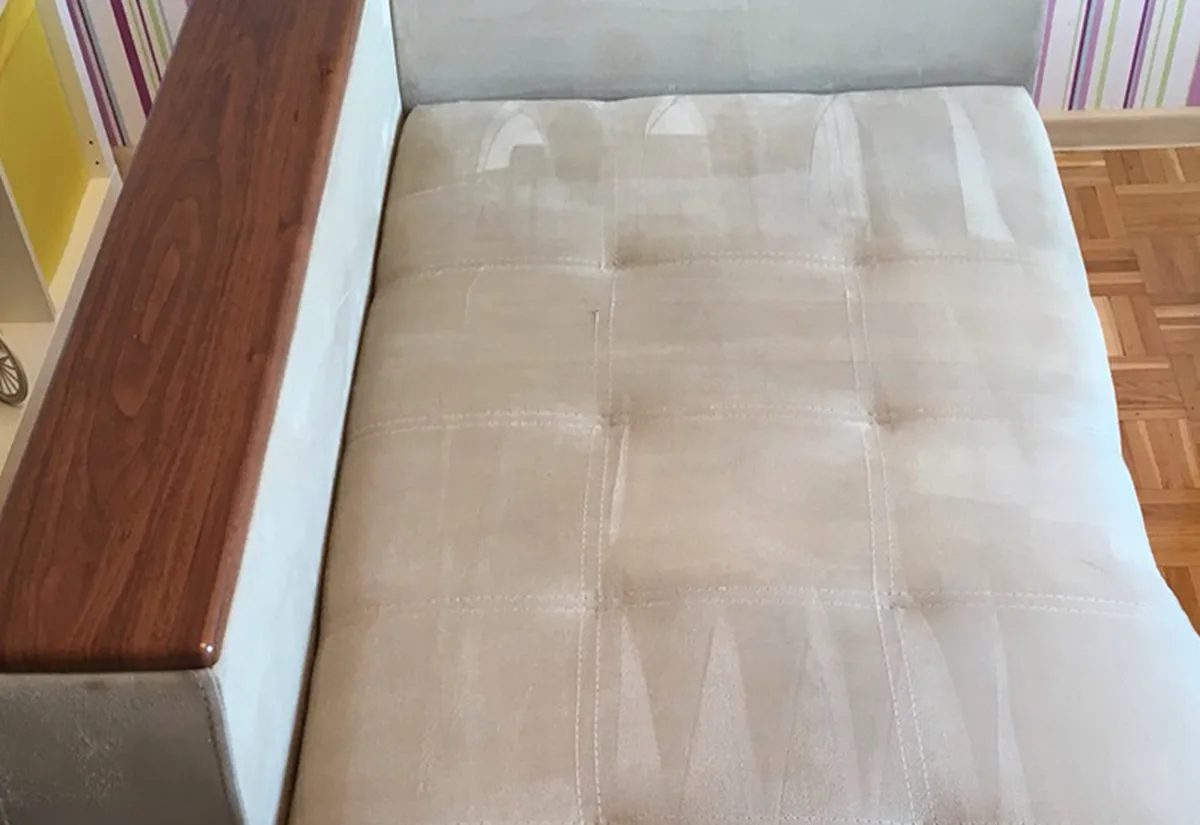 Beige microfibre chaise after cleaning &mdash; even, light upholstery with fresh extraction stripes.