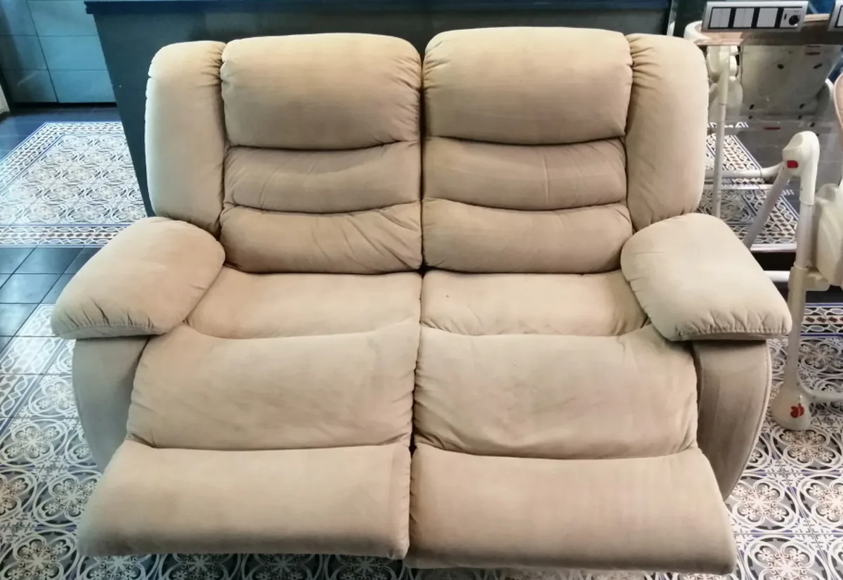 Beige fabric recliner loveseat after a deep clean &mdash; even, light upholstery and no spill mark.